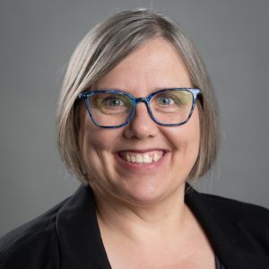 A headshot of Rhonda Graf in a black cardigan.