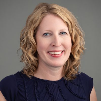 A headshot of Dr. Erin Lowery in a navy top.
