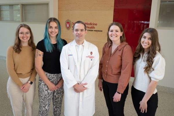 A photo of the cystic fibrosis research team. From left to right: Cate Wilkinson, Melanie Nelson, Dr. Andrew Braun, Megan Devereaux, and Nikki Cole.